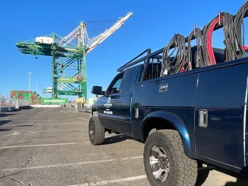 Mobile welding service truck loaded with coils at Port of Oakland industrial site